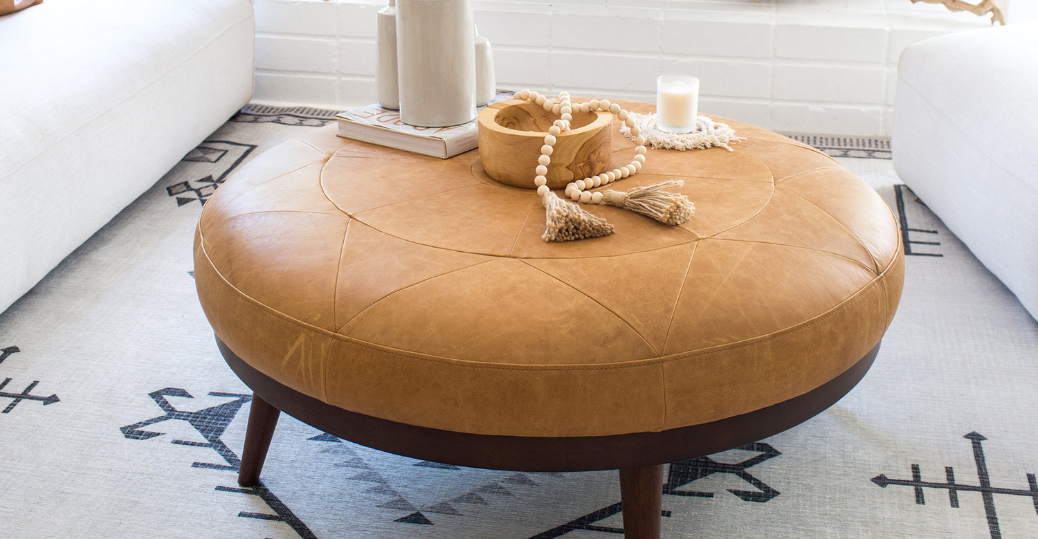 Round cognac store ottoman